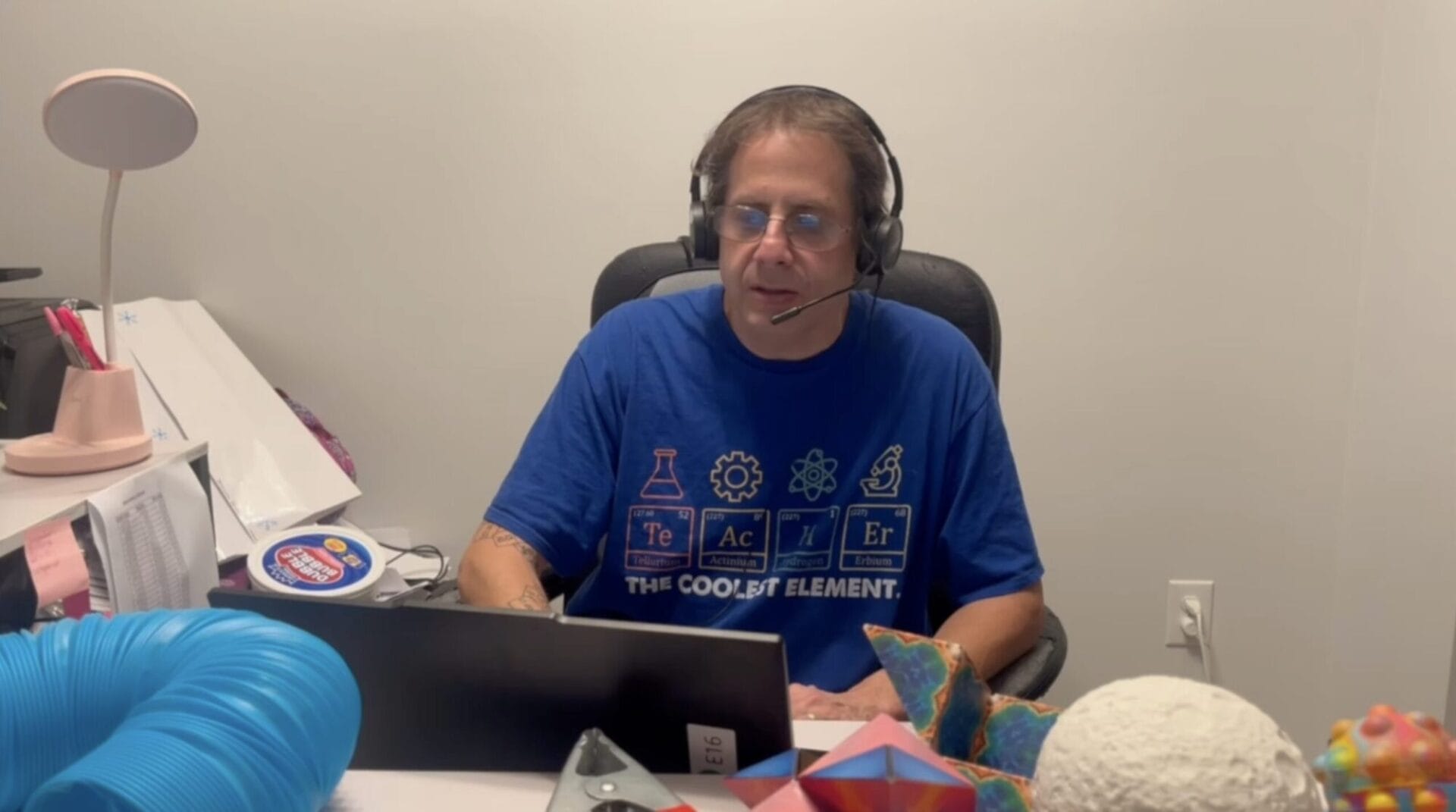 Larry Biederman wearing a black pair of headphones